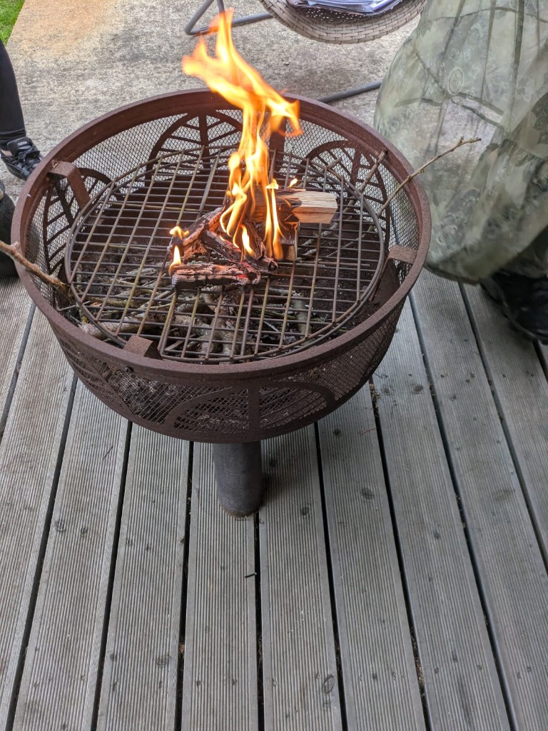 Fire pit glowing on the deck after a session
